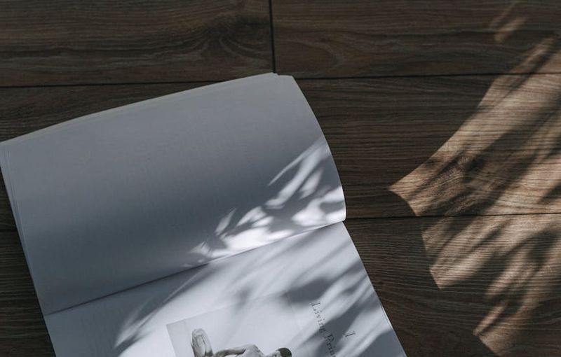 A calm yoga space with a rolled mat and natural light.